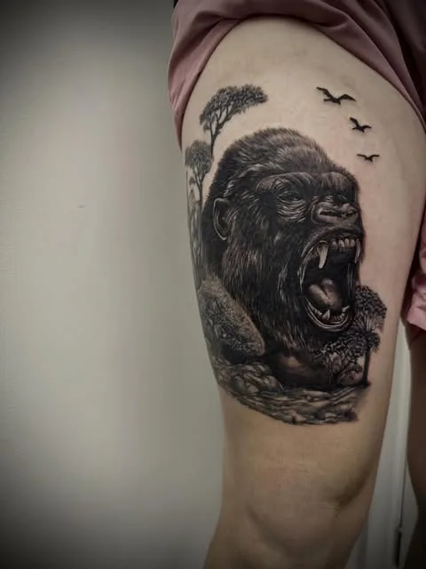 Black and grey animal portrait tattoo