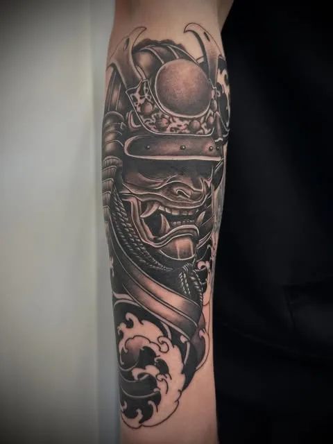 Ornamental black and grey sleeve tattoo